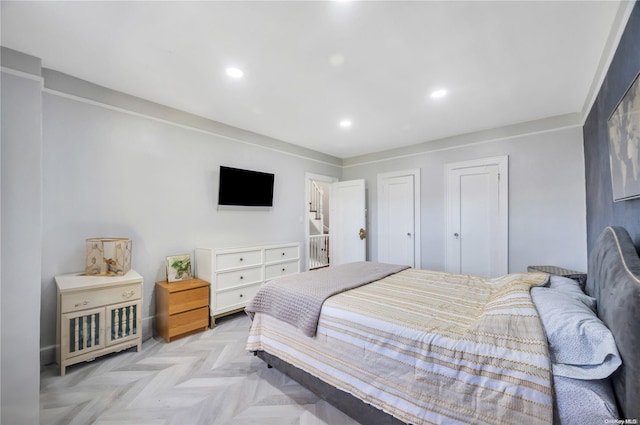 bedroom featuring light parquet floors