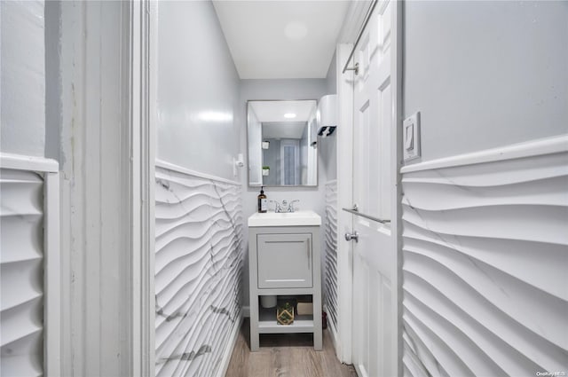 bathroom with vanity and hardwood / wood-style floors