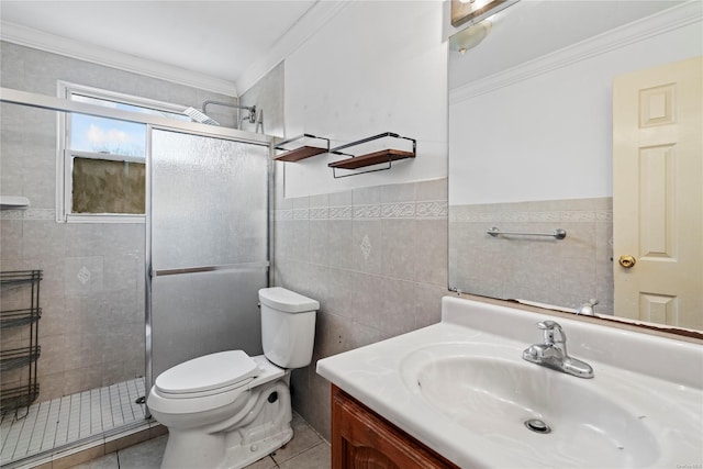 bathroom with vanity, crown molding, tile walls, tile patterned flooring, and toilet