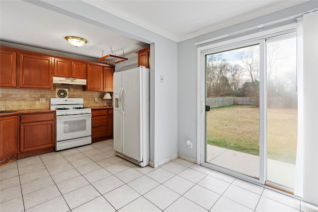 kitchen featuring decorative backsplash, light tile patterned flooring, white appliances, and ornamental molding