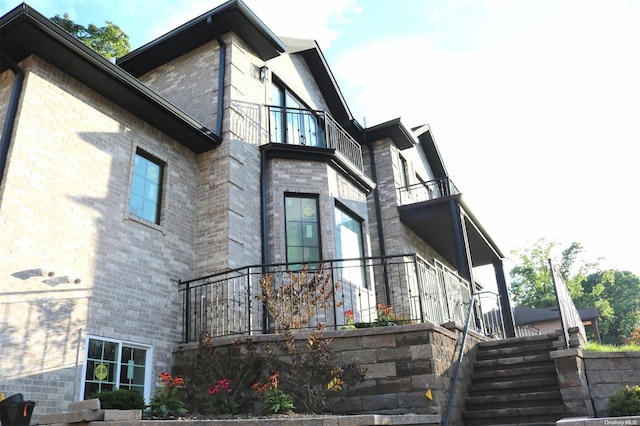 view of home's exterior with a balcony