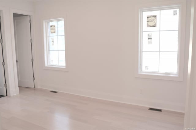 spare room with light wood-type flooring