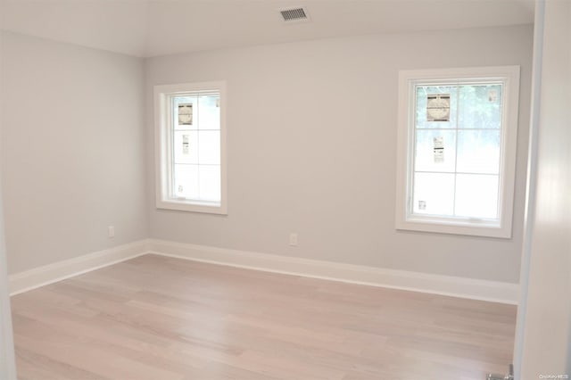 spare room with light hardwood / wood-style floors