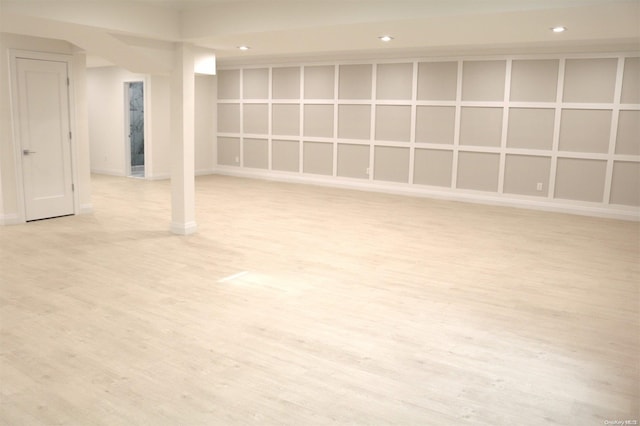 basement featuring light wood-type flooring