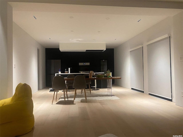 interior space featuring fridge and light wood-type flooring