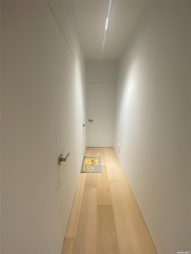 hall with light wood-type flooring