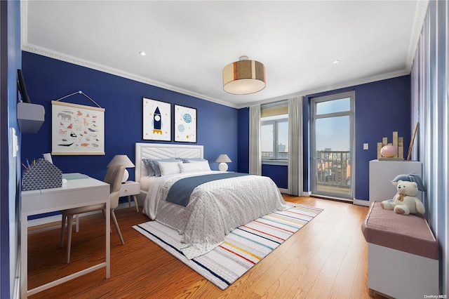 bedroom with access to exterior, wood-type flooring, and ornamental molding