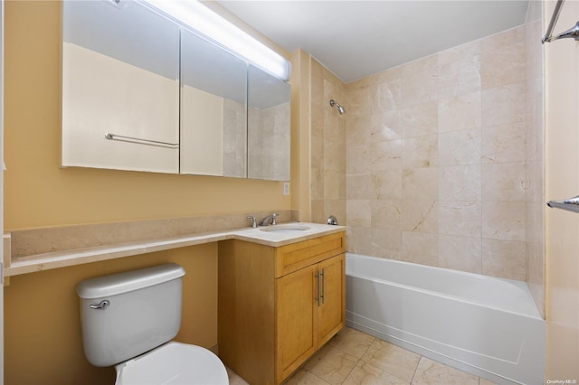 full bathroom featuring vanity, tiled shower / bath combo, and toilet