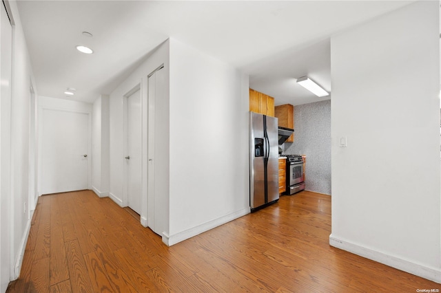 corridor featuring light hardwood / wood-style floors