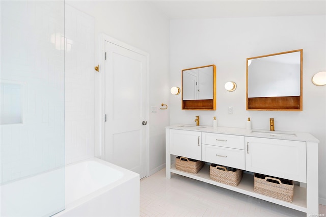 bathroom featuring vanity and a bath