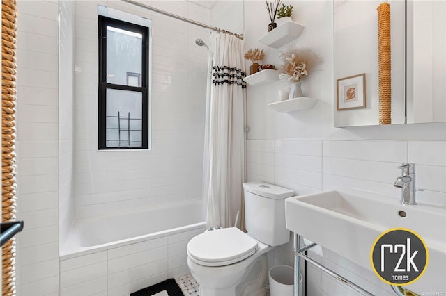 full bathroom with shower / bath combination with curtain, toilet, tile walls, and sink