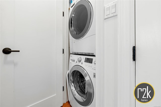 laundry area with stacked washer and dryer