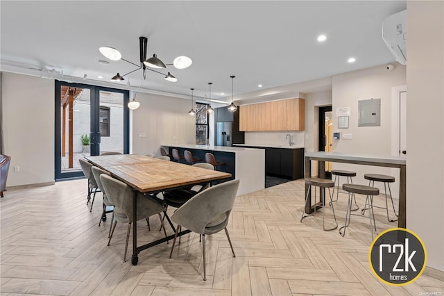 dining space featuring electric panel, crown molding, and light parquet floors