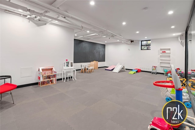 recreation room with a wall unit AC