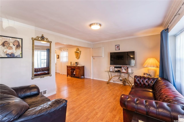 living room featuring hardwood / wood-style flooring and ornamental molding