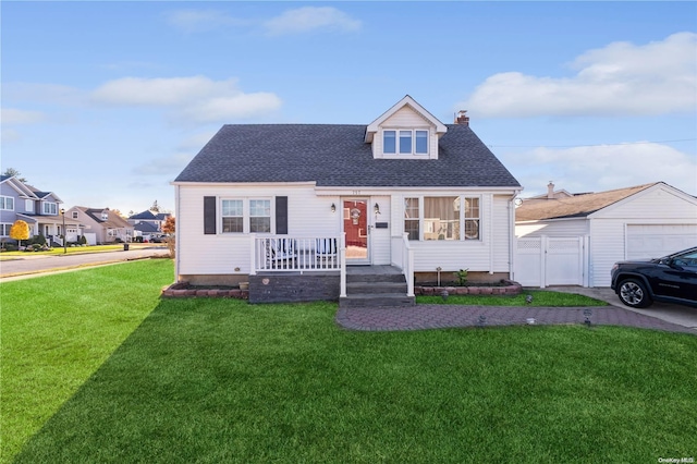 cape cod house with a front lawn