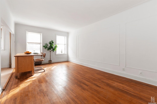 unfurnished office featuring light wood-type flooring