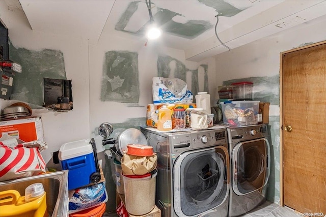 washroom featuring washer and dryer