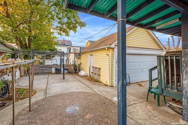 view of patio / terrace with an outbuilding