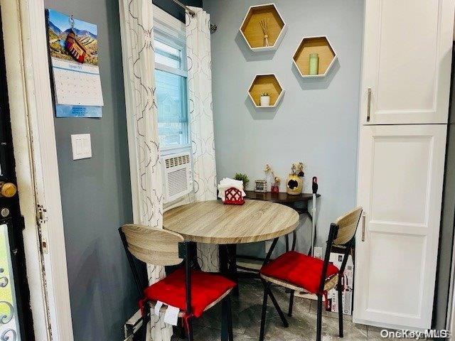 dining area featuring cooling unit