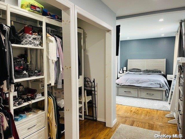 bedroom with wood-type flooring