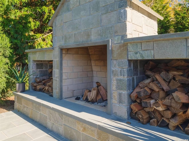 details featuring an outdoor stone fireplace