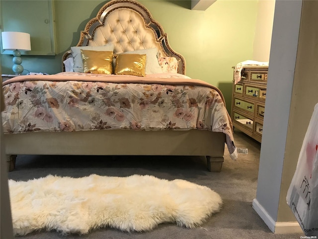 bedroom featuring dark colored carpet