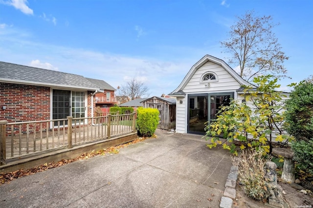 exterior space with a storage shed