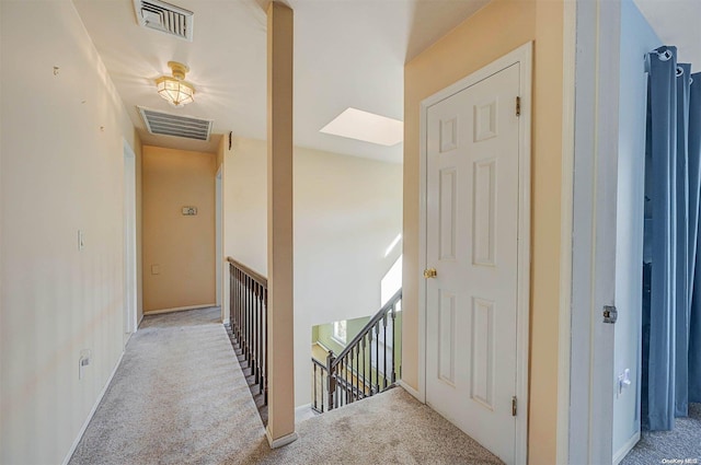 hallway featuring light carpet