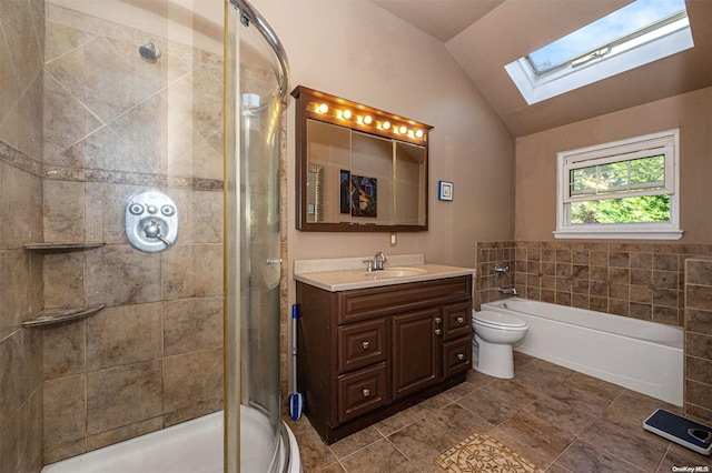 full bathroom featuring tile patterned floors, vaulted ceiling with skylight, vanity, separate shower and tub, and toilet