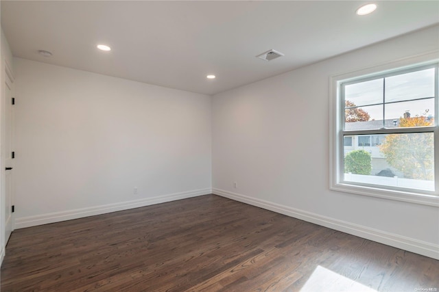 empty room with dark hardwood / wood-style floors