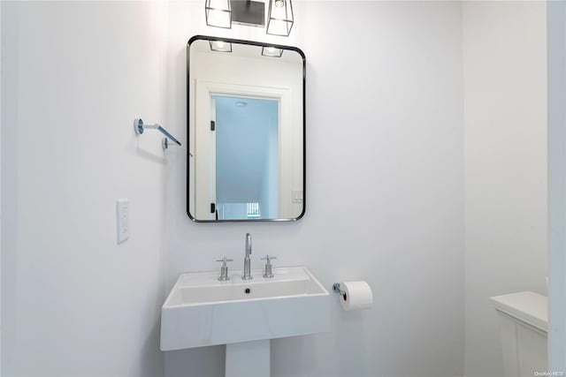 1956 Leonard Ln, Merrick, NY 11566 - half bathroom with toilet and a sink