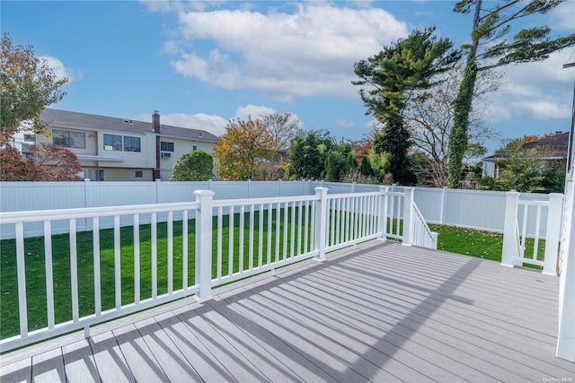 wooden terrace with a yard