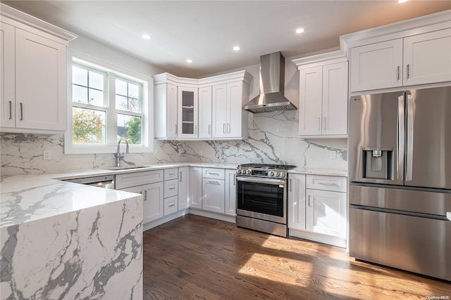 1956 Leonard Ln, Merrick, NY 11566 - kitchen with stainless steel appliances, wall chimney range hood, a sink, light stone counters, and recessed lighting