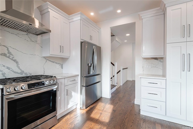 1956 Leonard Ln, Merrick, NY 11566 - kitchen with appliances with stainless steel finishes, wall chimney range hood, backsplash, dark wood-style flooring, and white cabinets