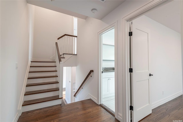 staircase featuring hardwood / wood-style flooring