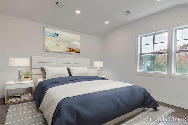 1956 Leonard Ln, Merrick, NY 11566 - bedroom featuring wood finished floors, lofted ceiling, multiple windows, baseboards, and recessed lighting
