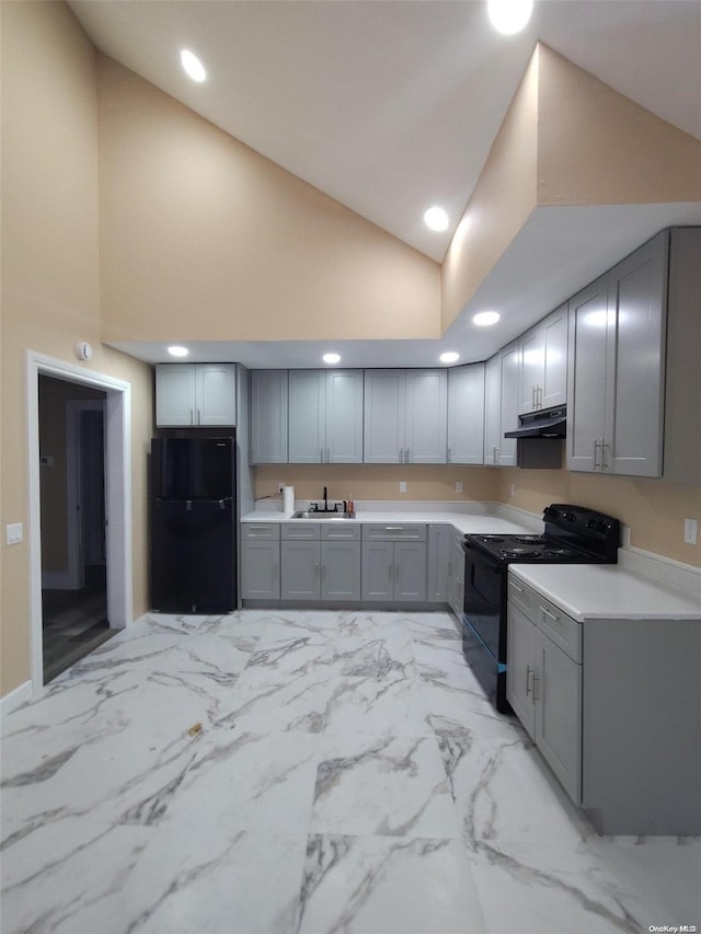 kitchen with black appliances, gray cabinets, sink, and high vaulted ceiling