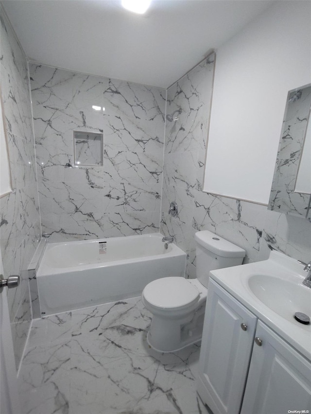 full bathroom with vanity, toilet, and tiled shower / bath combo