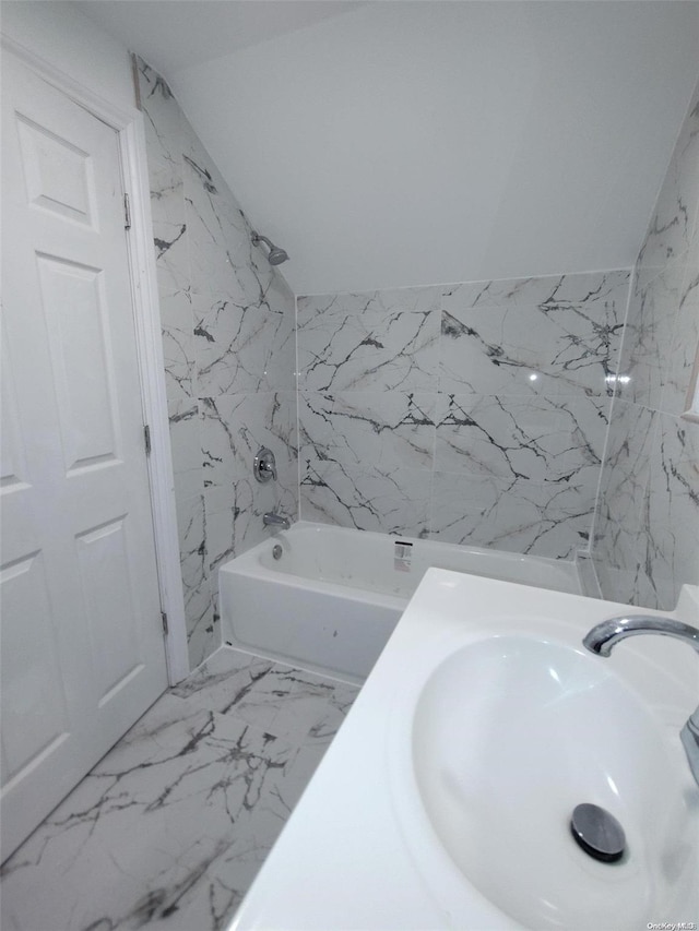 bathroom featuring  shower combination and sink