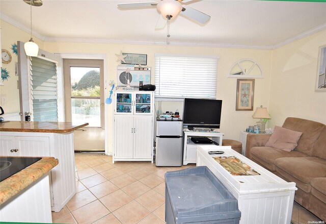 50 Rampasture Rd Unit 6, Hampton Bays, NY 11946 - living area featuring ceiling fan, crown molding, and light tile patterned floors