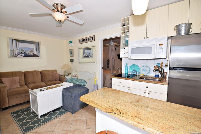 50 Rampasture Rd Unit 6, Hampton Bays, NY 11946 - living area featuring crown molding, light tile patterned flooring, and a ceiling fan