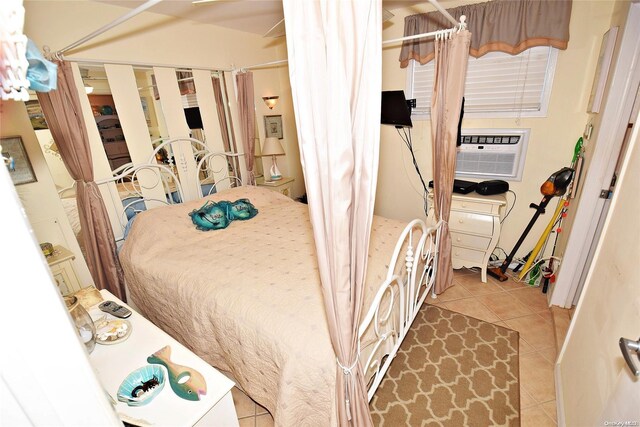 50 Rampasture Rd Unit 6, Hampton Bays, NY 11946 - bedroom with cooling unit and light tile patterned floors