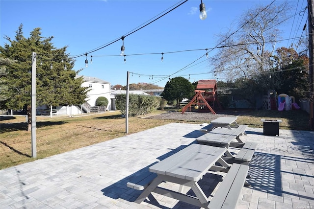 50 Rampasture Rd Unit 6, Hampton Bays, NY 11946 - view of patio featuring a playground