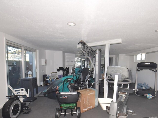 50 Rampasture Rd Unit 6, Hampton Bays, NY 11946 - exercise room with a textured ceiling