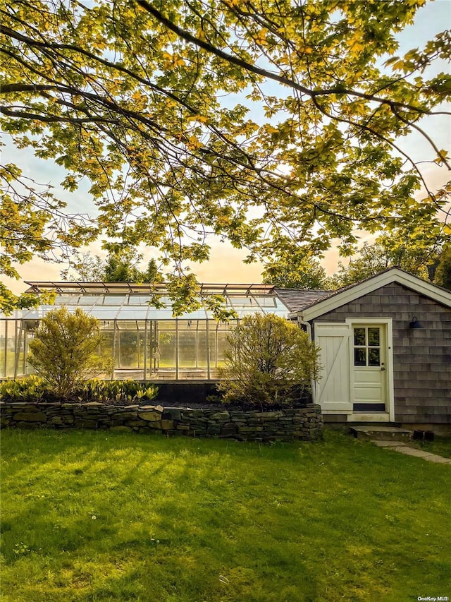 4170/3375 Indian Neck Ln, Peconic, NY 11958 - yard at dusk featuring an outbuilding