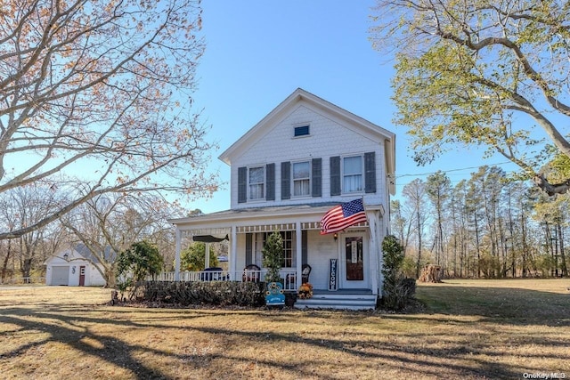 view of front of property featuring covered porch and a front yard