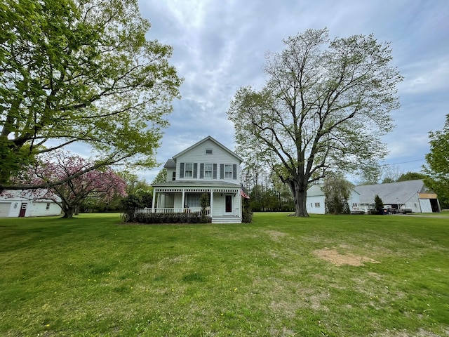 2055 Boisseau Ave, Southold, NY 11971 - view of front facade featuring a front yard and covered porch