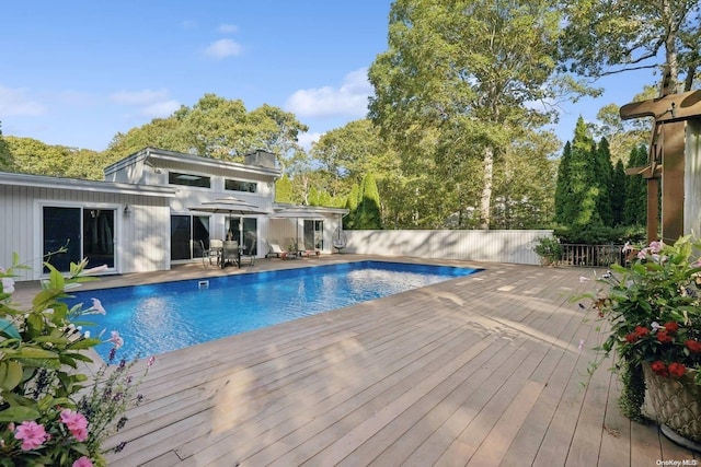 view of swimming pool featuring a deck