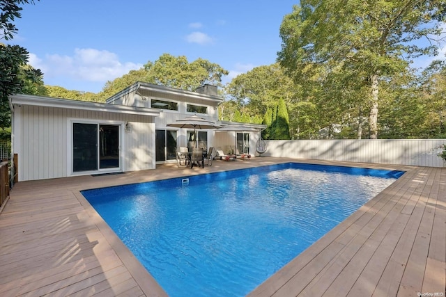 view of swimming pool with a wooden deck